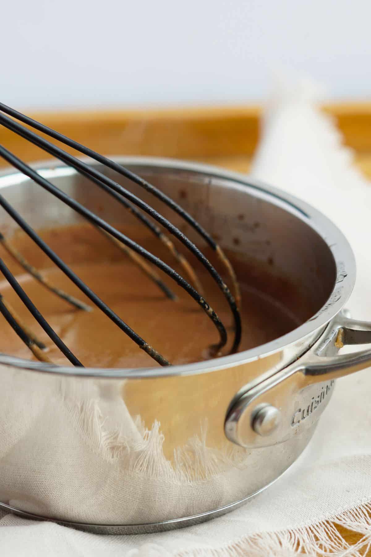 hot chocolate being whisked in pot