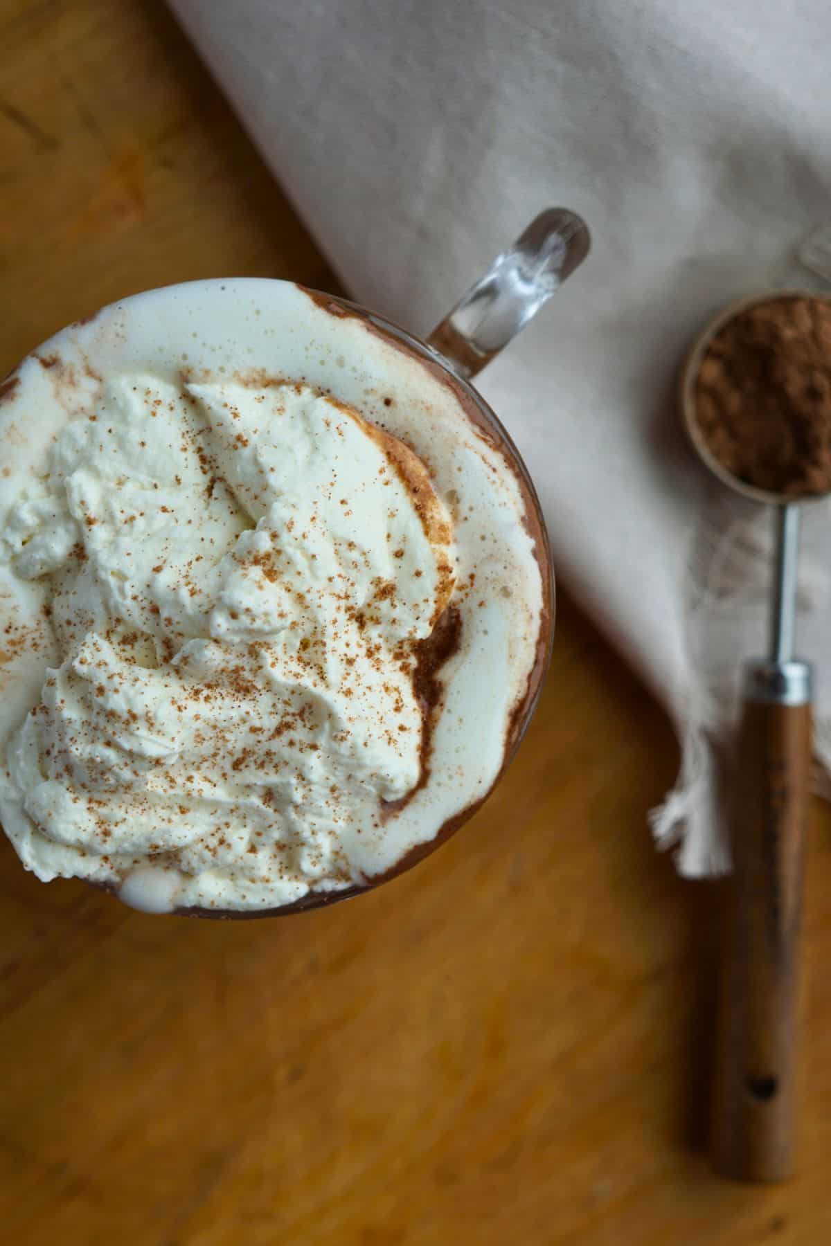 close up of whipped cream on bone broth hot chocolate