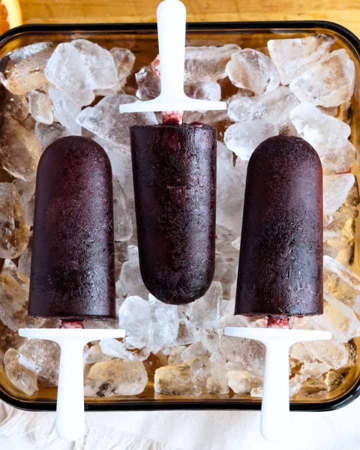 elderberry popsicles on dish of ice