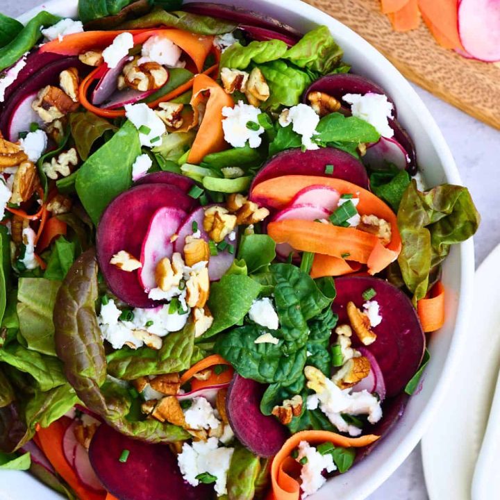 spring salad in white bowl
