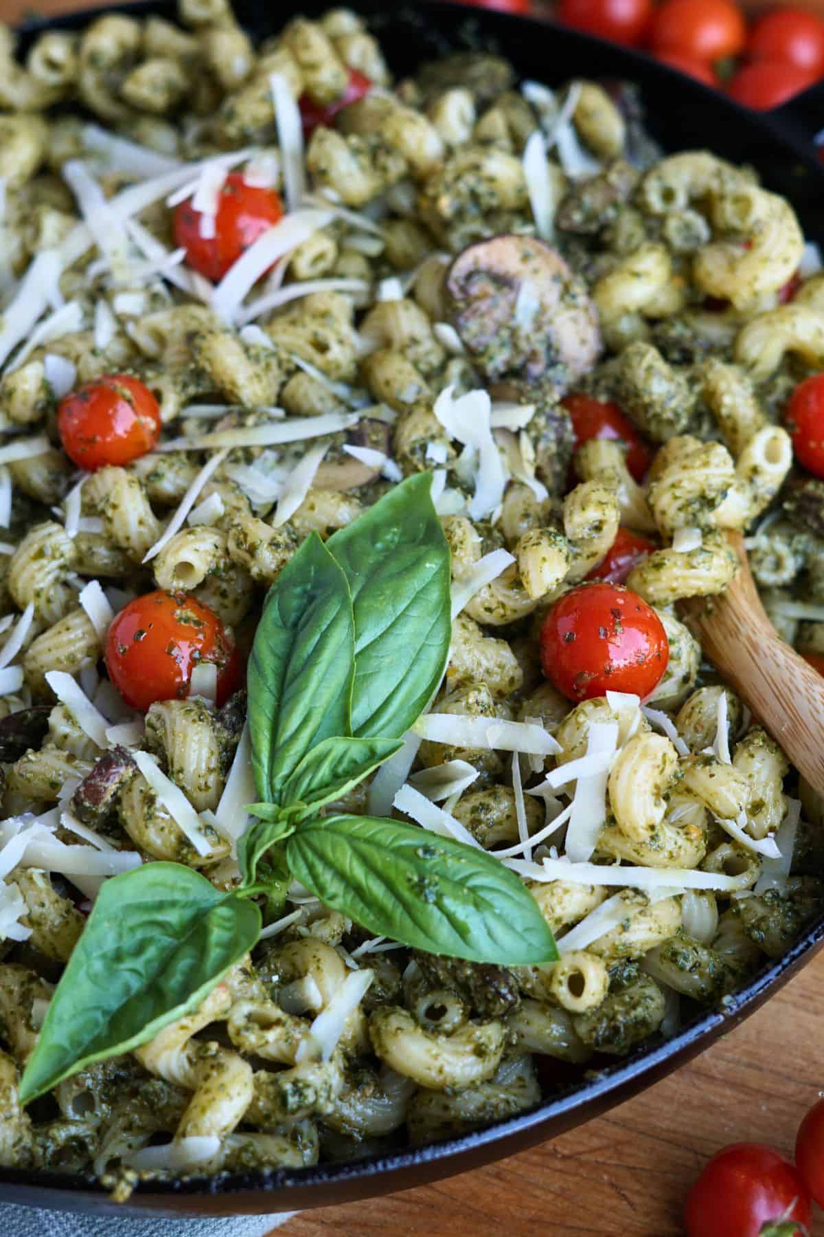 close up of finished pesto cavatappi in cast iron pan