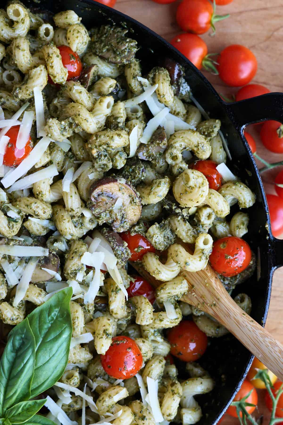close up of finished pesto cavatappi in cast iron pan